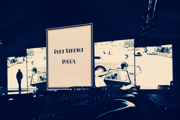 Video screens and stage at fashion event